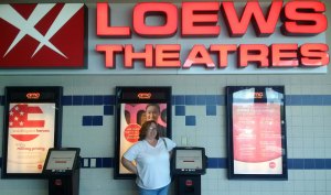 Orange County apparently can't afford posters of the movies they show. Note the poster behind me says "serving our heroes", not "herpes" as I originally thought. Awkward!